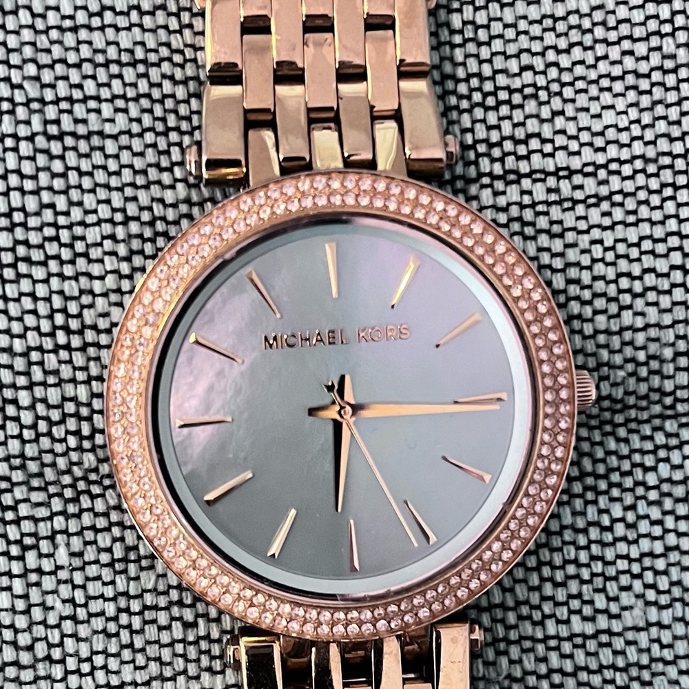 Michael Kors gold watch with glitz crystals, light turquoise face
